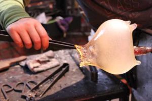 Paula Hayes working on hot glass piece