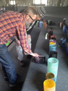 Virgil Parti with Hank Adams and his collection of glass cylinders