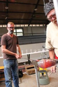 Virgil Marti working with artist on glass piece