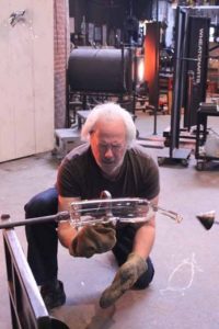 Artist Donald Lipski working on glass piece