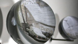 Reflection of car in glass by Hyunsung Cho