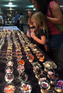 Children observing paperweight gallery