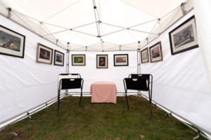 A display showcasing a collection of photography by Dennis Abriola