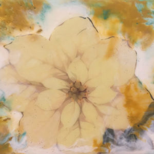 A photograph of a muted yellow flower seamlessly blended into a yellow and green encaustic painting by Anna Kuczynski