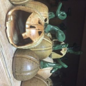 Clay pumpkins with green stems and wide smiling jack-o-lantern faces. Created for Tessa Peterzak’s Clay Pumpkins class.