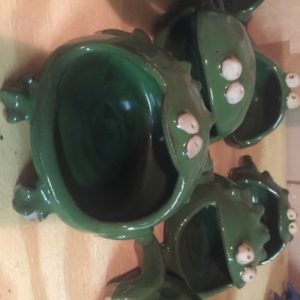 Green frog sponge holders with a wide mouth and tiny eyes. Created for Tessa Peterzak’s Frog/Monster Sponge Holder class