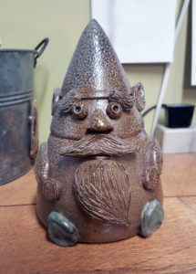 Brown salt fired ceramic gnome.