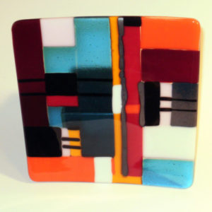 Colorful fused multicolor glass panel, reminiscent of color field painting, created for Robert Murray's Kiln Glass class