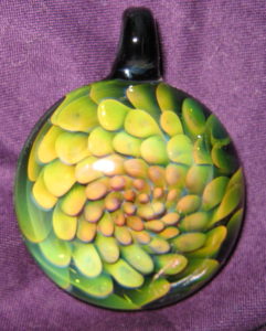 Green and yellow botanical flamework pendant by Bill Futer