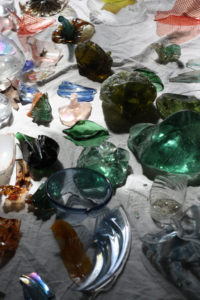 A mix of colorful pieces of glass being recycled for Torchia's kaleidoscope.