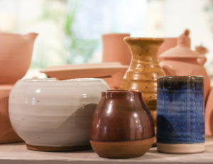 Examples of the 4 glaze options to choose from: white, brown, yellow, and blue.