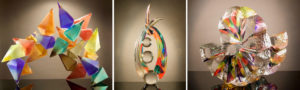 three multi-colored glass sculptures of different styles by Richard Royal.