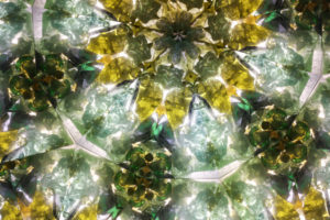 Close-up view of kaleidoscope image generated by the drum filled with transition glass, or cullet specifically derived from bottle production.