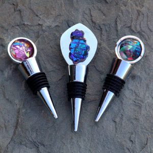 Three glass wine bottle stoppers with colorful dichroic glass accents by Diana Koziupa