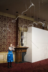 Laura Baird plays a long winding glass horn during "Phantom Frequencies" in the Museum of American Glass