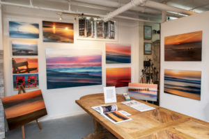 Collection of photography by Frederick Ballet in a booth space