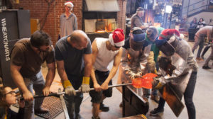 Big Glass Blast Team sculpting a large gather of glass