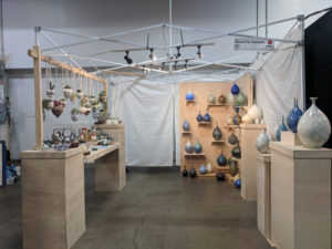 Booth showcasing the ceramic works of Erika Novak and Drew Darley