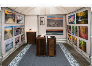 Collection of photography by Christopher Costa in a booth setting.