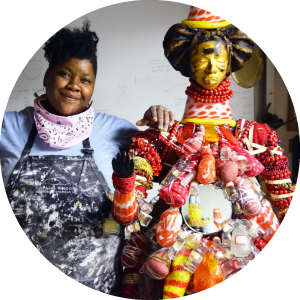 Emantion 2017 artist Vanessa German with one of her red and gold glass dolls.
