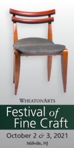 A vertical banner for the WheatonArts Festival of Fine Craft on October 2 & 3, 2021. A wooden chair with a gray cushion by William Robbins sits on top of the text.