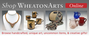 Shop WheatonArts Online banner. The text on bottom reads "Browse handcrafted, unique art, uncommon items, & creative gifts!" Four images left to right, a necklace with a triangle motif, four mugs with animal silhouettes, a bag with a scarf with butterflies draped over it, and three glass pitchers in red, blue and clear.