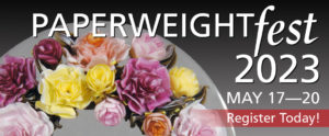 "Paperweight fest 2023" is in large white text over a dark background and above the top of a paperweight, forming half of a flower arch. "May 17 - 20: Register Today!" is at the bottom right of the image.