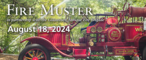 Image of the banner for Fire Muster. The background of the banner is a red antique fire truck with gold accents and lettering. On the left side of the image is a fire hose shooting an arc of water into the lake behind the truck. The area behind the truck has a lot of green trees with a lake behind it. There is white text in the top left corner of the banner that reads "Fire Muster". There is smaller italicized text underneath that reads "in partnership with the Glasstown Antique Fire Brigade". The date of the event is listed under this text in white lettering and reads "August 18, 2024".